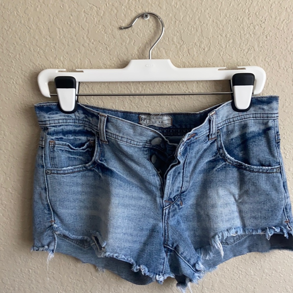 Free People denim jean shorts with frayed raw hem